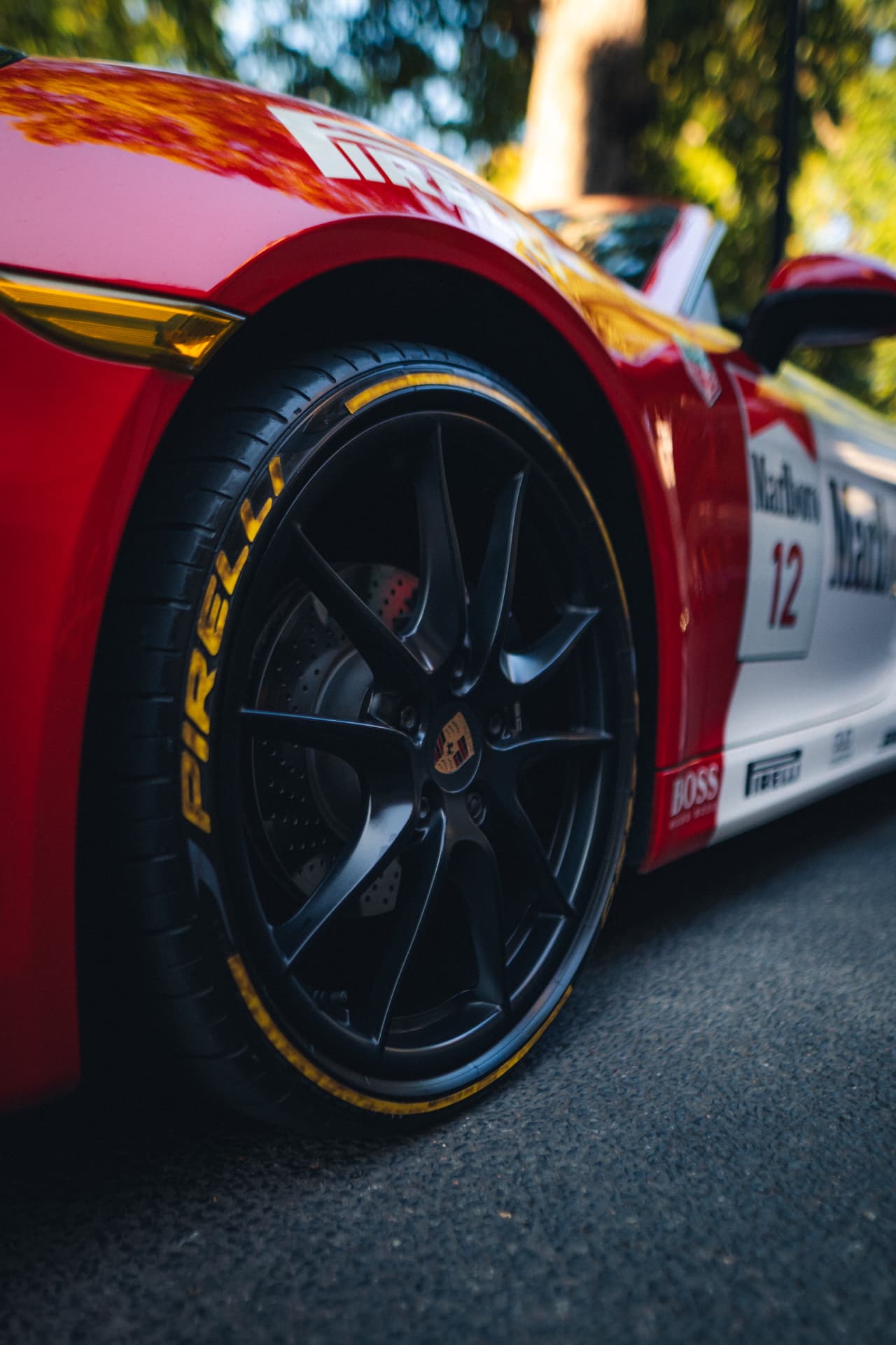 Close detail of a race-liveried Porsche wheel
